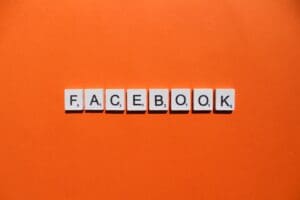Facebook scrabble letters word on a orange background